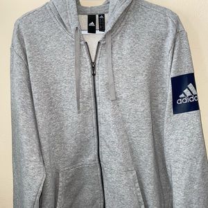 Grey adidas zip up hoodie.